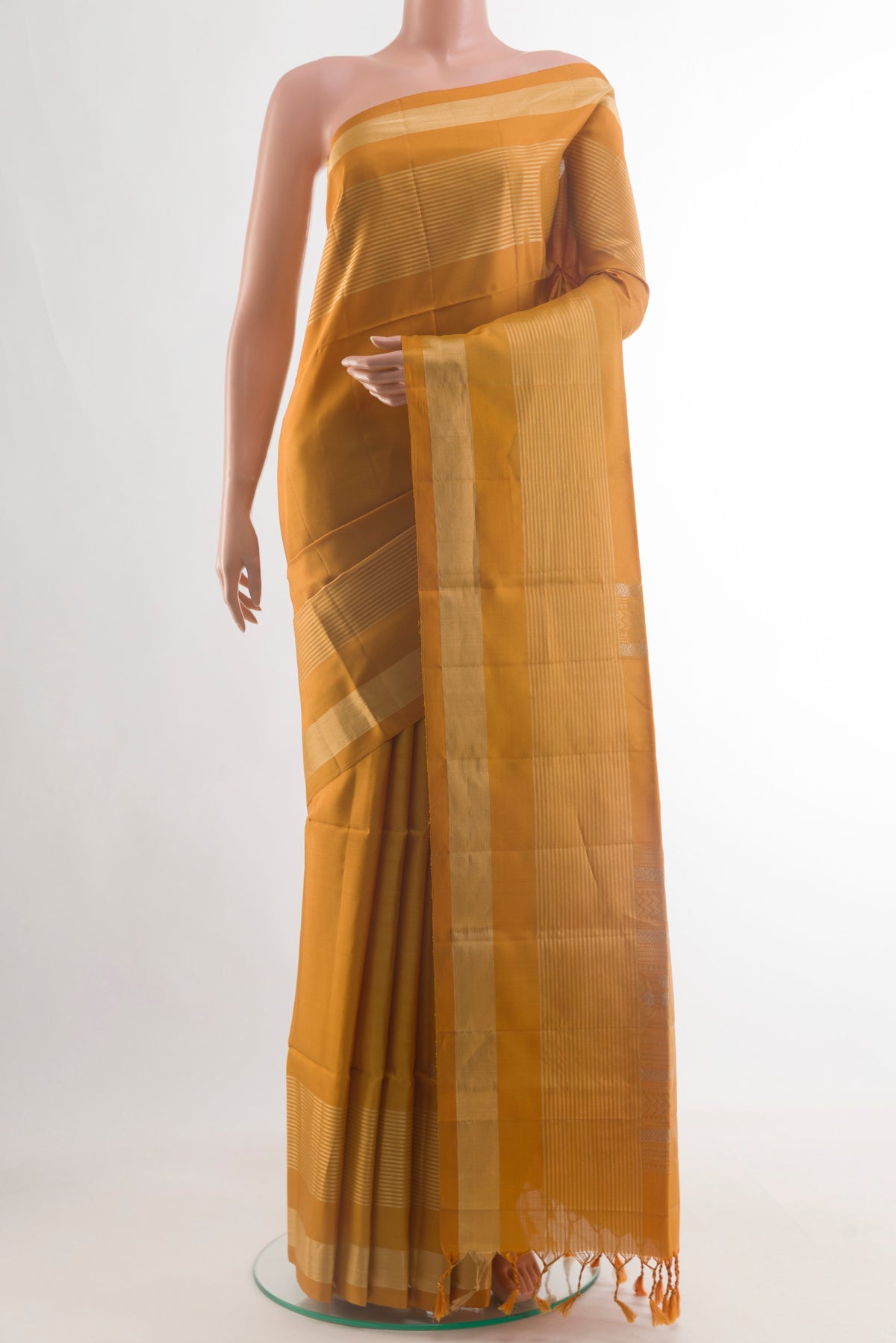 Pure Silk Yellow Soft Saree with Zari Butta on the body and Zari Border.  displayed on a mannequin
