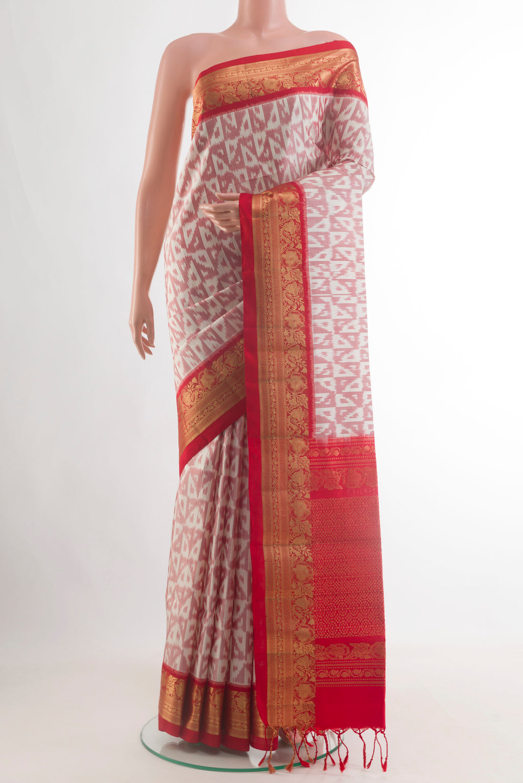 Pure Silk Off White Soft Saree with Pure Ikat on the body and Zari Border.  displayed on a mannequin