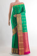 Pure Silk Sea Green Kanchipuram Saree with Zari Butta on the body and Zari Border.  displayed on a mannequin