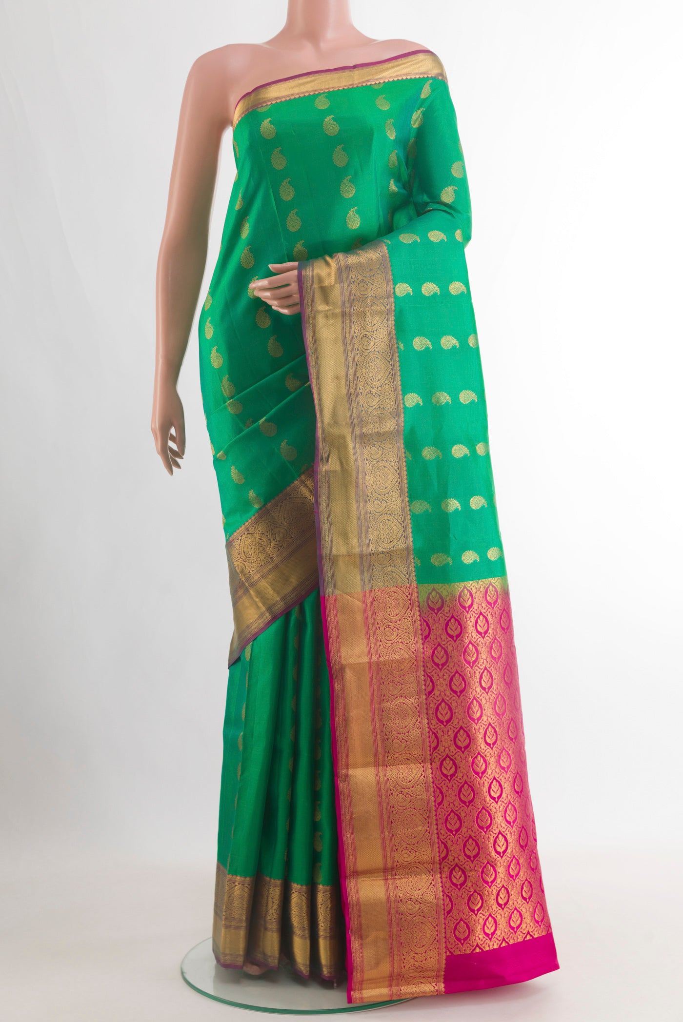 Pure Silk Sea Green Kanchipuram Saree with Zari Butta on the body and Zari Border.  displayed on a mannequin