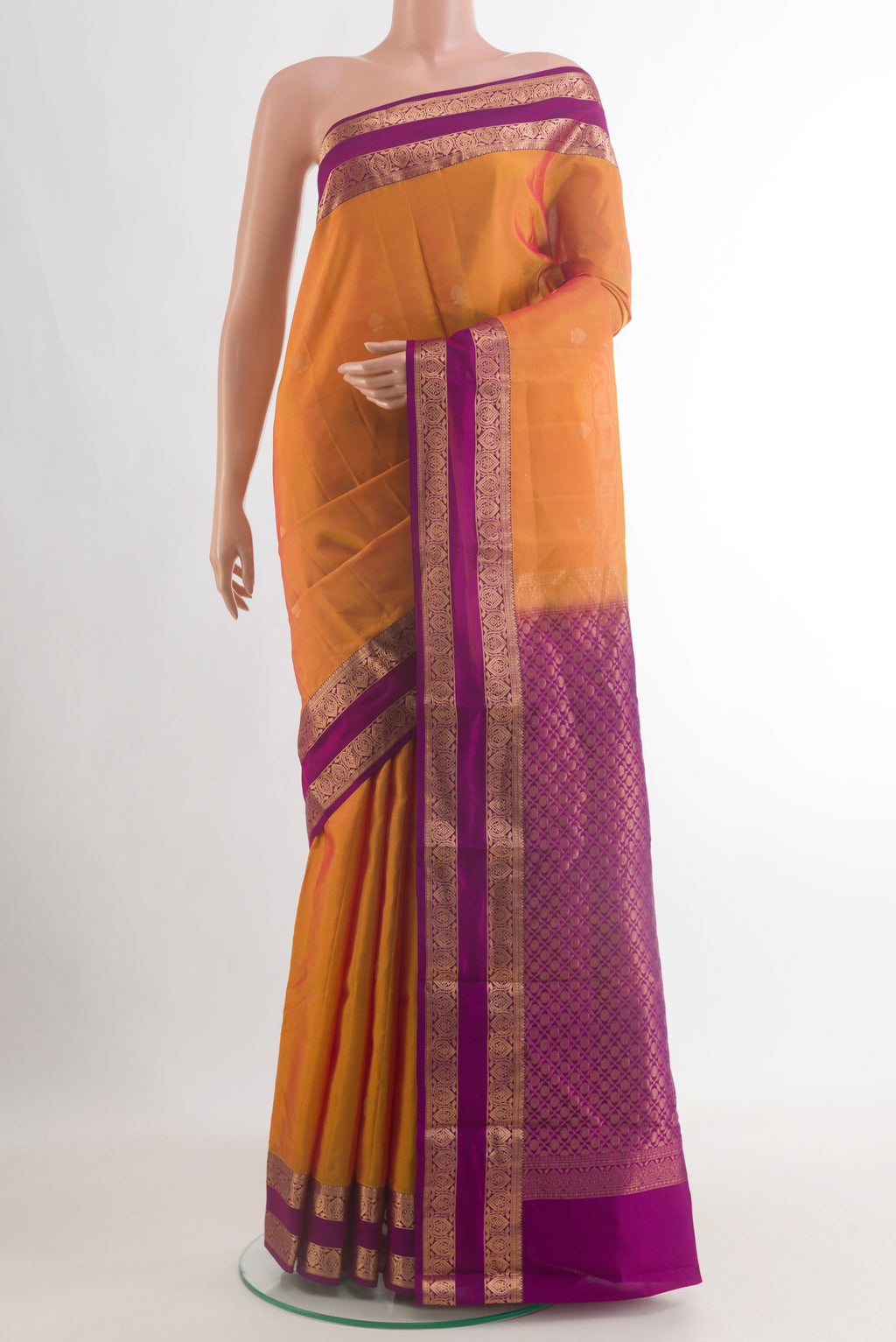 Pure Silk Orange Kanchipuram Saree with Zari Butta on the body and Zari Border.  displayed on a mannequin