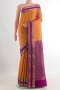 Pure Silk Orange Kanchipuram Saree with Zari Butta on the body and Zari Border.  displayed on a mannequin