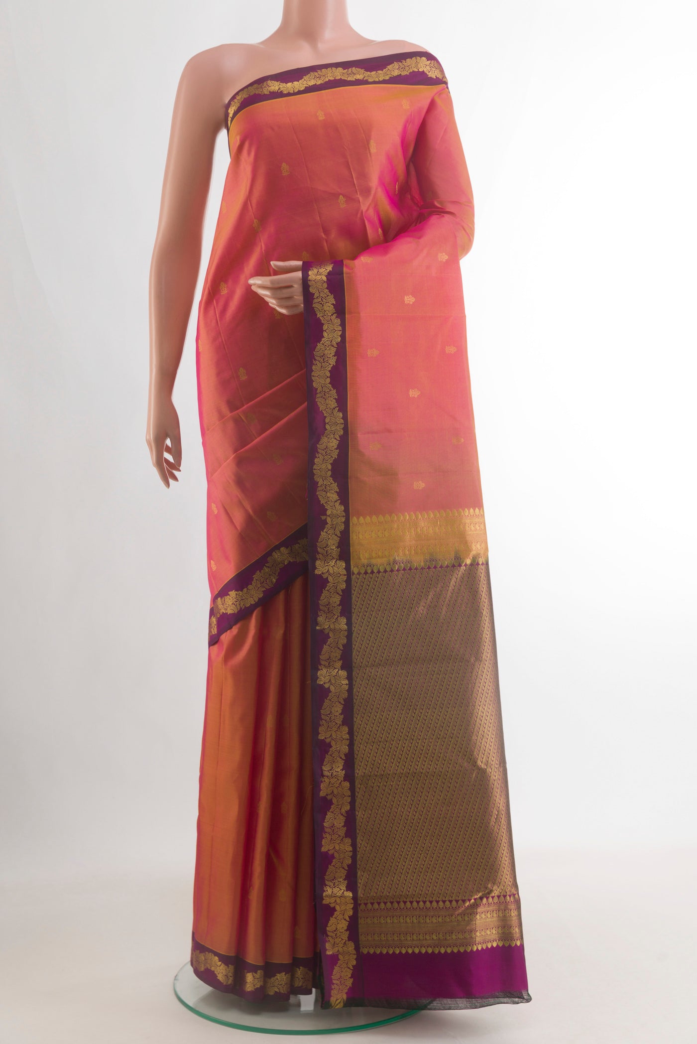 Pure Silk Pinkish Yellow Dual Tone Kanchipuram Saree with Zari Butta on the body and Zari Border.  displayed on a mannequin