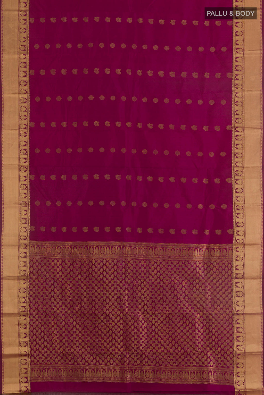 Flat view of Pure Silk Magenta Kanjivaram Saree with Zari Butta on the body and Zari Border. 
