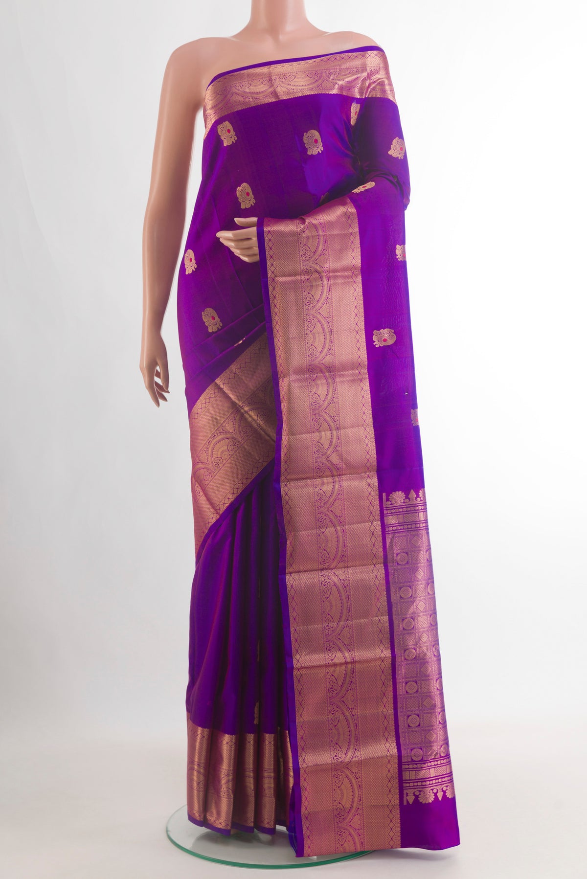 Pure Silk Purple Kanchipuram Saree with Zari Butta on the body and Zari Border.  displayed on a mannequin