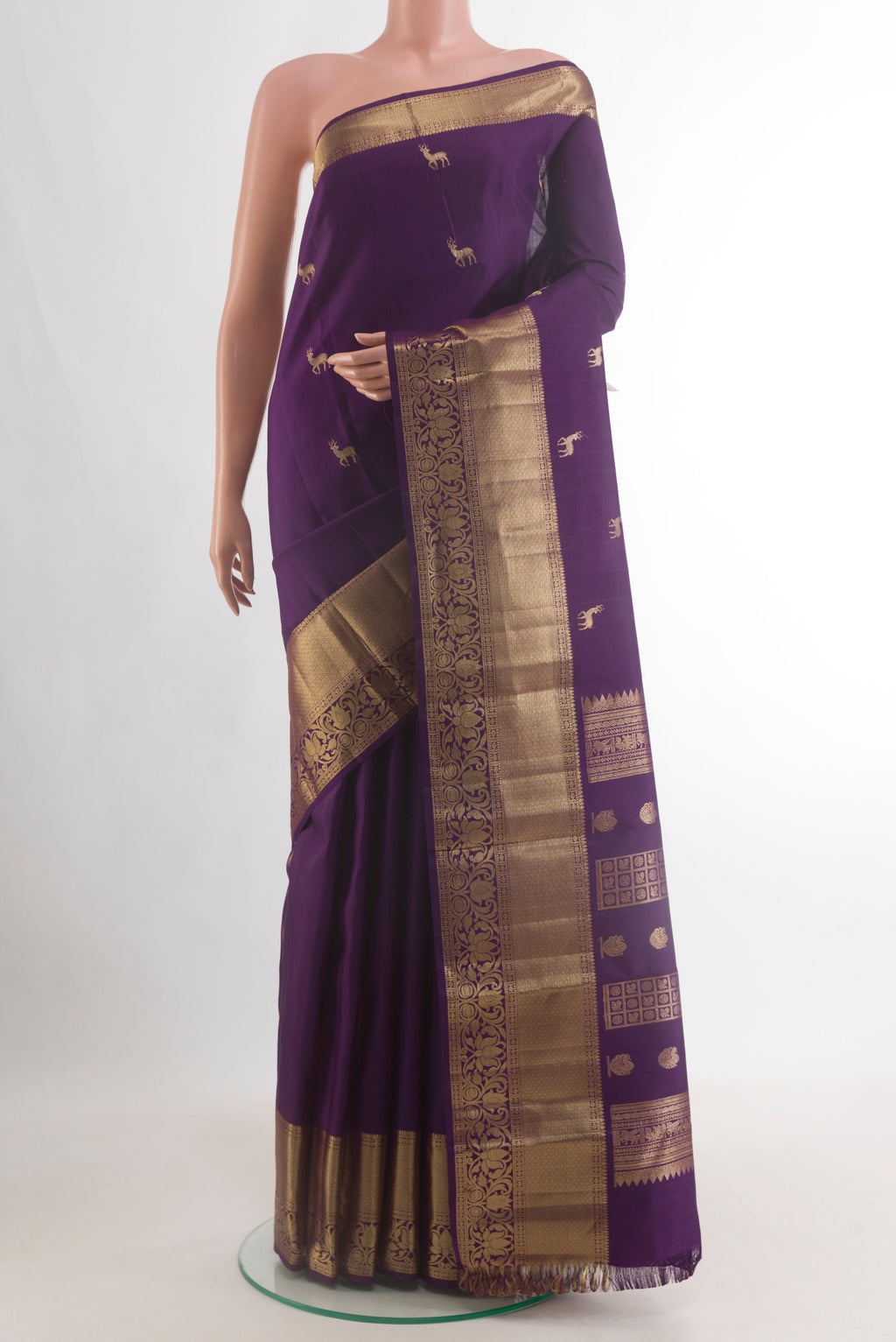 Pure Silk Purple Kanchipuram Saree with Zari Butta on the body and Zari Border.  displayed on a mannequin