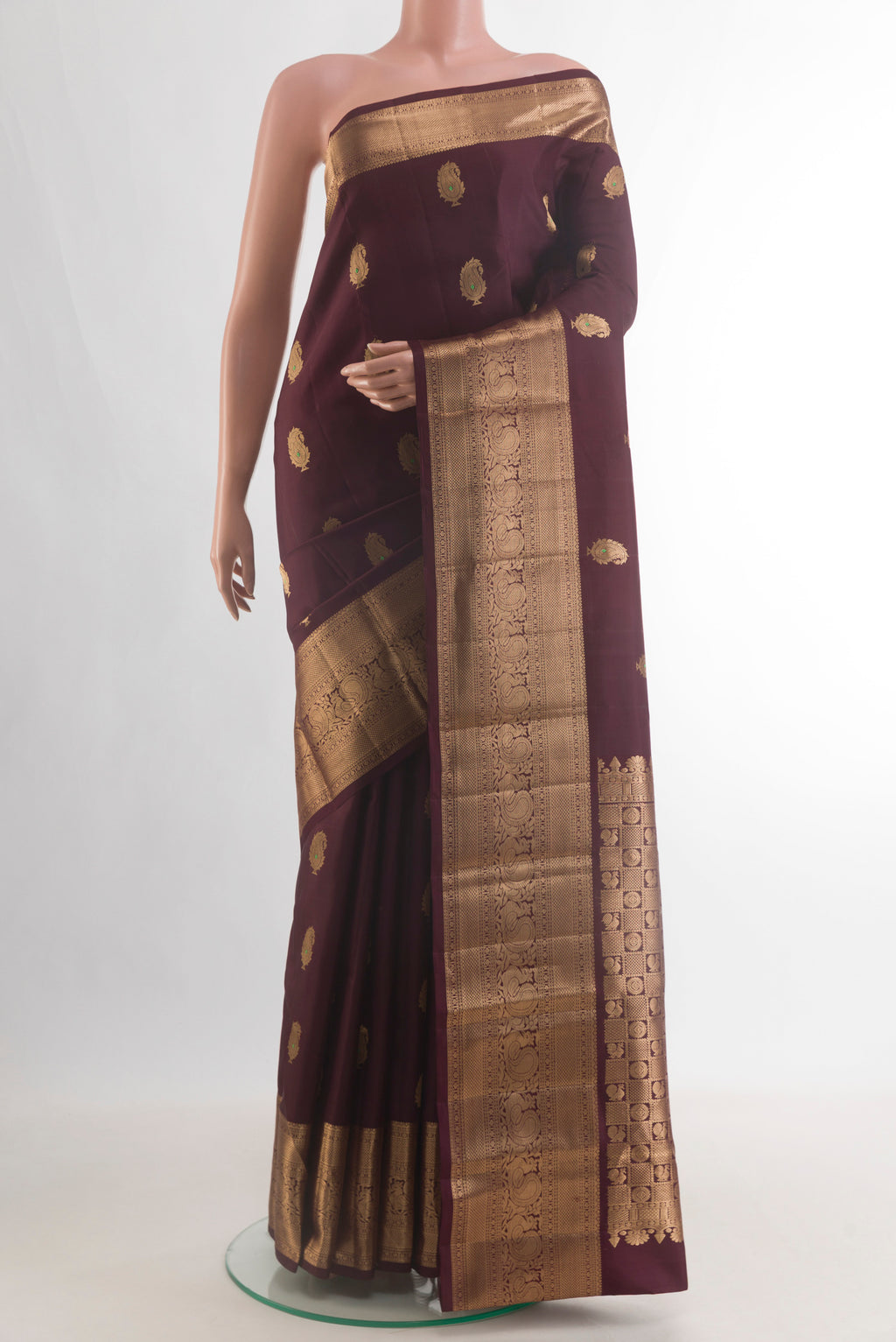 Pure Silk Coffee Brown Kanchipuram Saree with Zari Butta on the body and Zari Border.  displayed on a mannequin