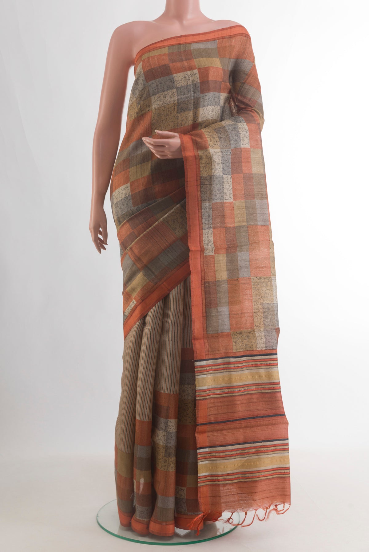 Multi Color Tussar Saree with Geometric Print on the body and Zari Border.  displayed on a mannequin