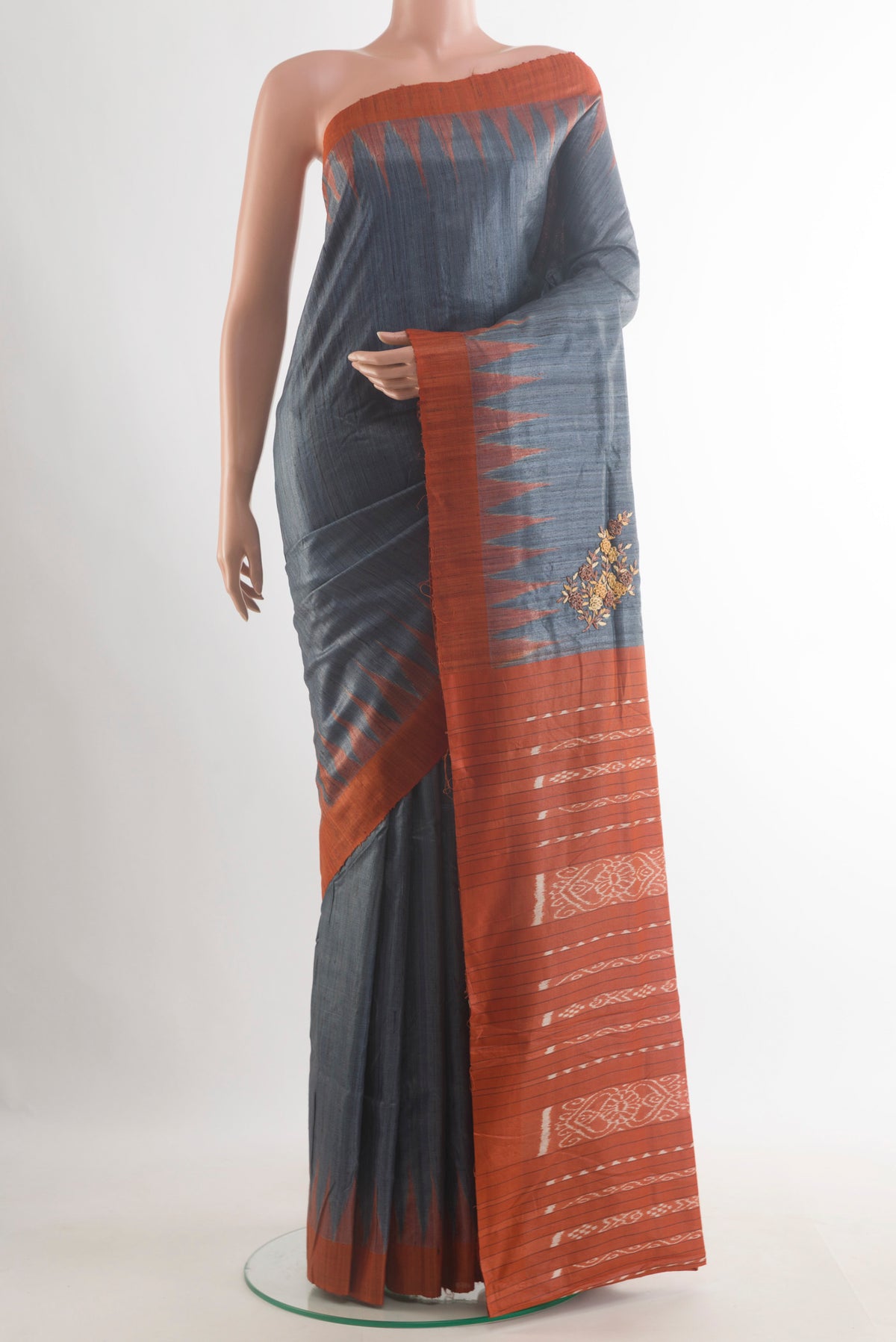 Grey Tussar Saree with Plain Body and Temple Border.  displayed on a mannequin