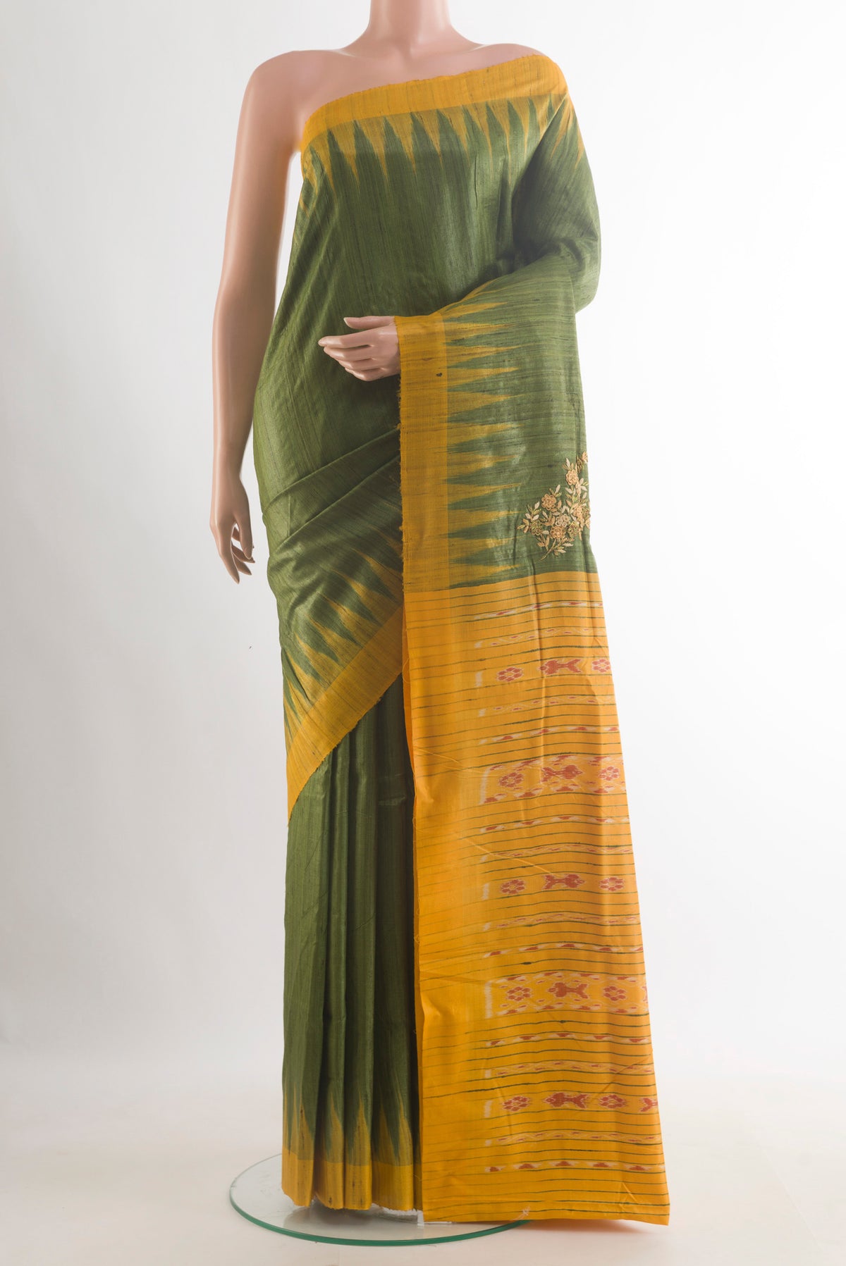 Green Tussar Saree with Plain Body and Temple Border.  displayed on a mannequin