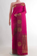Pure Silk Rani Pink Kanchipuram Saree with Zari Butta on the body and Fancy Border.  displayed on a mannequin