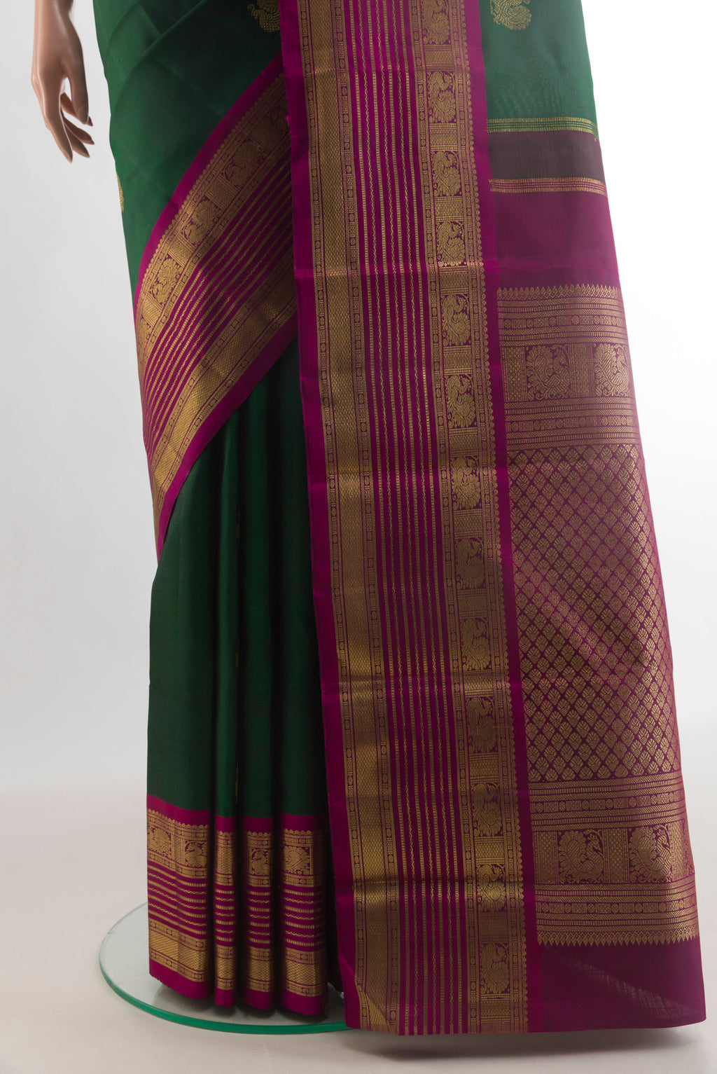 Pleats and pallu of Pure Silk Pure Zari Green Kanjivaram Saree with Zari Butta on the body and Zari Border. 