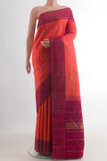 Pure Silk Orange Kanchipuram Saree with Zari Butta on the body and Plain Border.  displayed on a mannequin