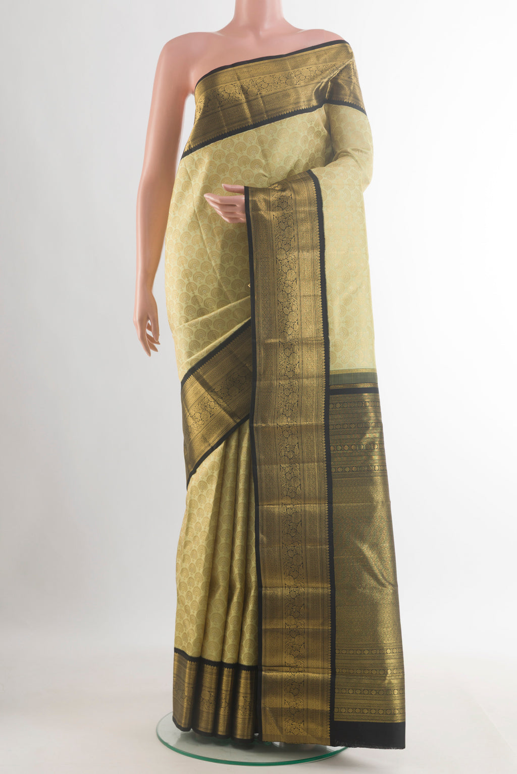 Pure Silk Cream Kanjivaram Saree with Zari Brocade on the body and Zari Border.  displayed on a mannequin