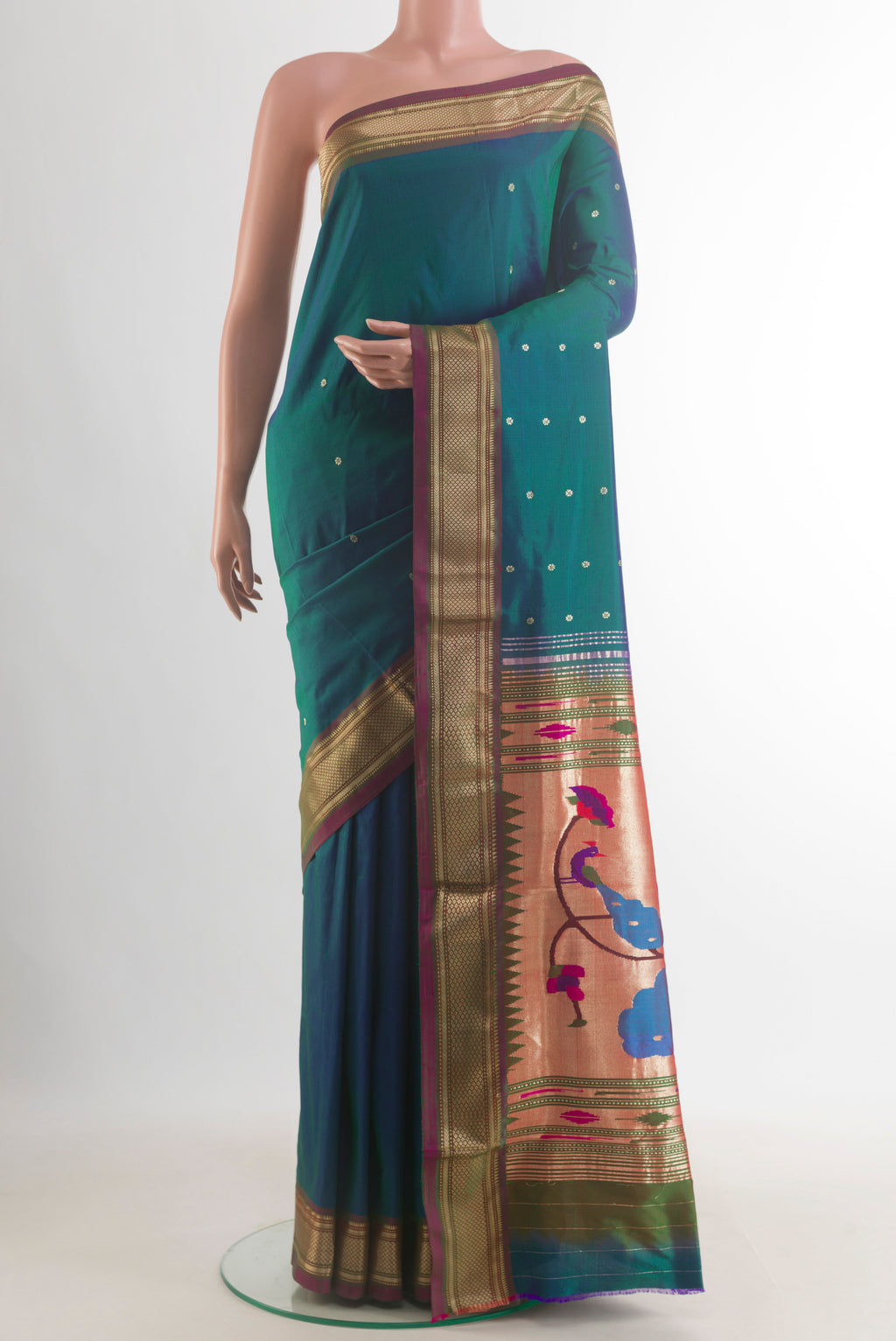Pure Silk Peacock Blue Dual Tone Paithani Saree with Zari Butta on the body and Zari Border.  displayed on a mannequin