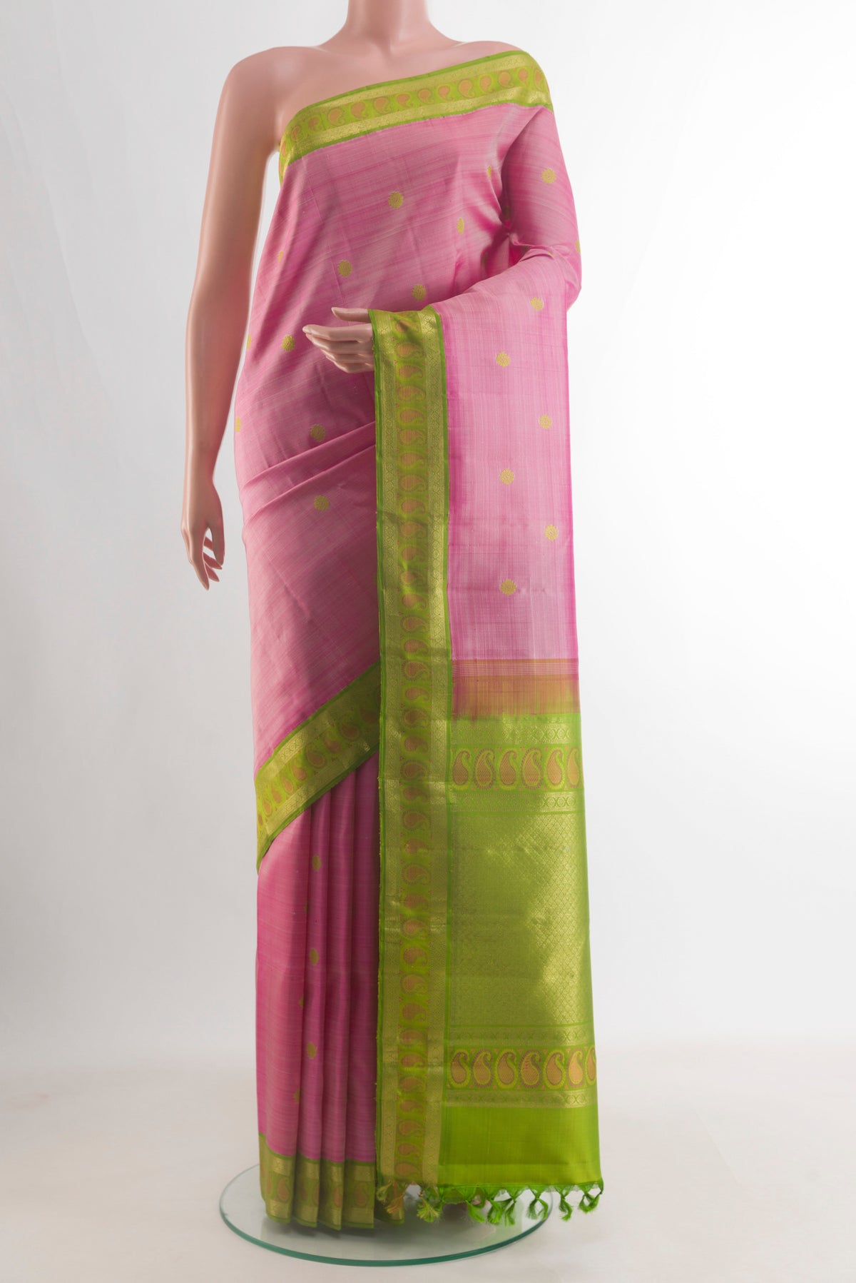 Pure Silk Pink Kanjivaram Saree with Thread Butta on the body and Zari Border.  displayed on a mannequin