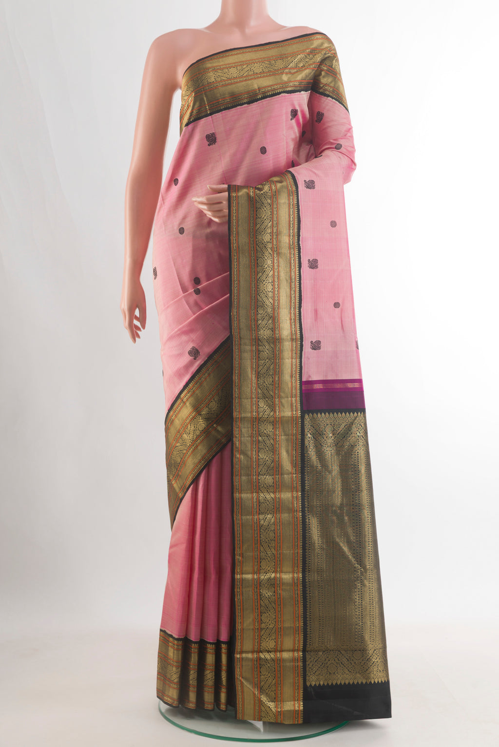Pure Silk Coral Kanjivaram Saree with Thread Butta on the body and Zari Border.  displayed on a mannequin