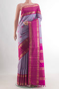 Pure Silk Lavender Kanjivaram Saree with Thread Butta on the body and Zari Border.  displayed on a mannequin