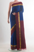 Pure Silk Blue Kanchipuram Saree with Plain Body and Zari Border.  displayed on a mannequin