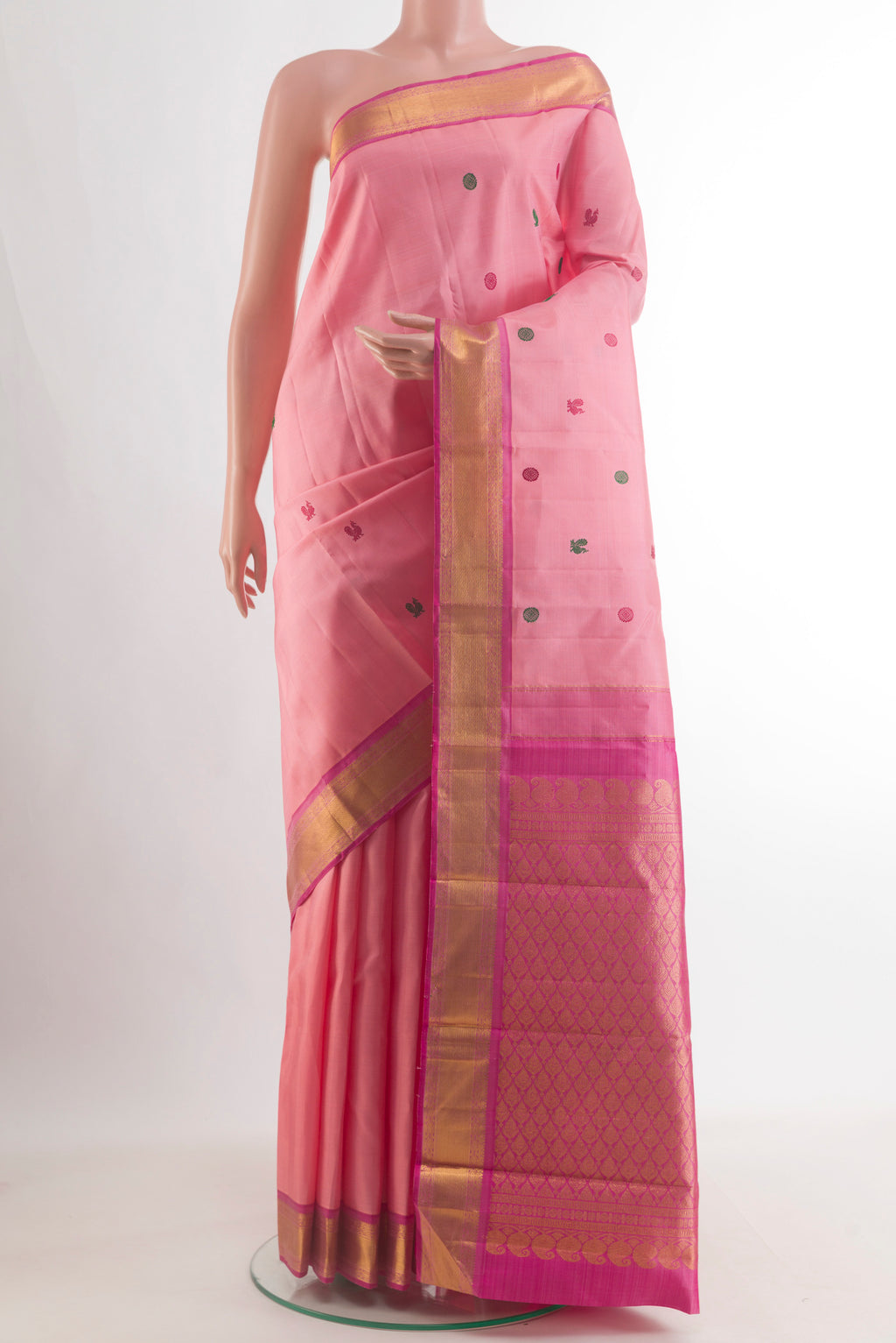 Pure Silk Peach Kanjivaram Saree with Thread Butta on the body and Zari Border.  displayed on a mannequin