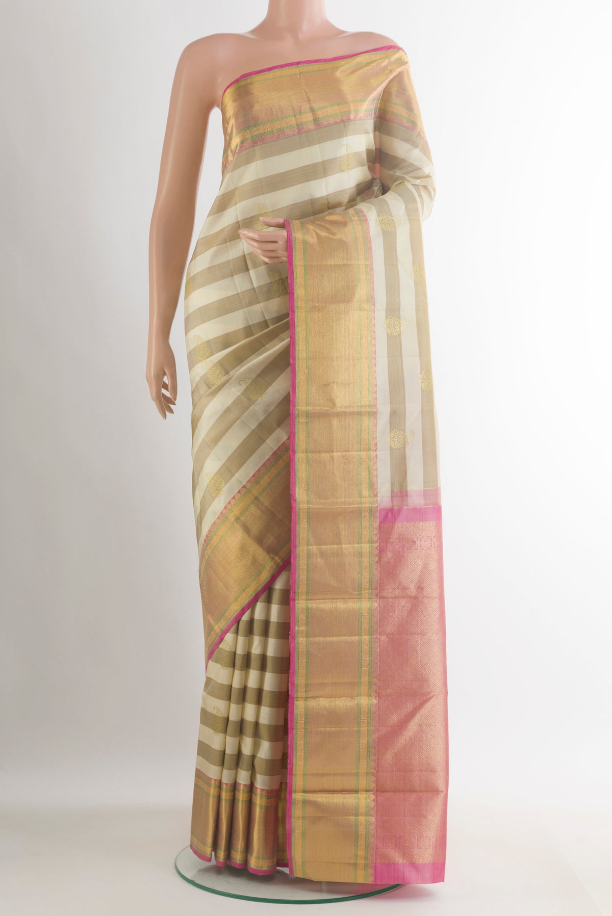 Pure Silk Off White Kanjivaram Saree with Stripes on the body and Zari Border.  displayed on a mannequin