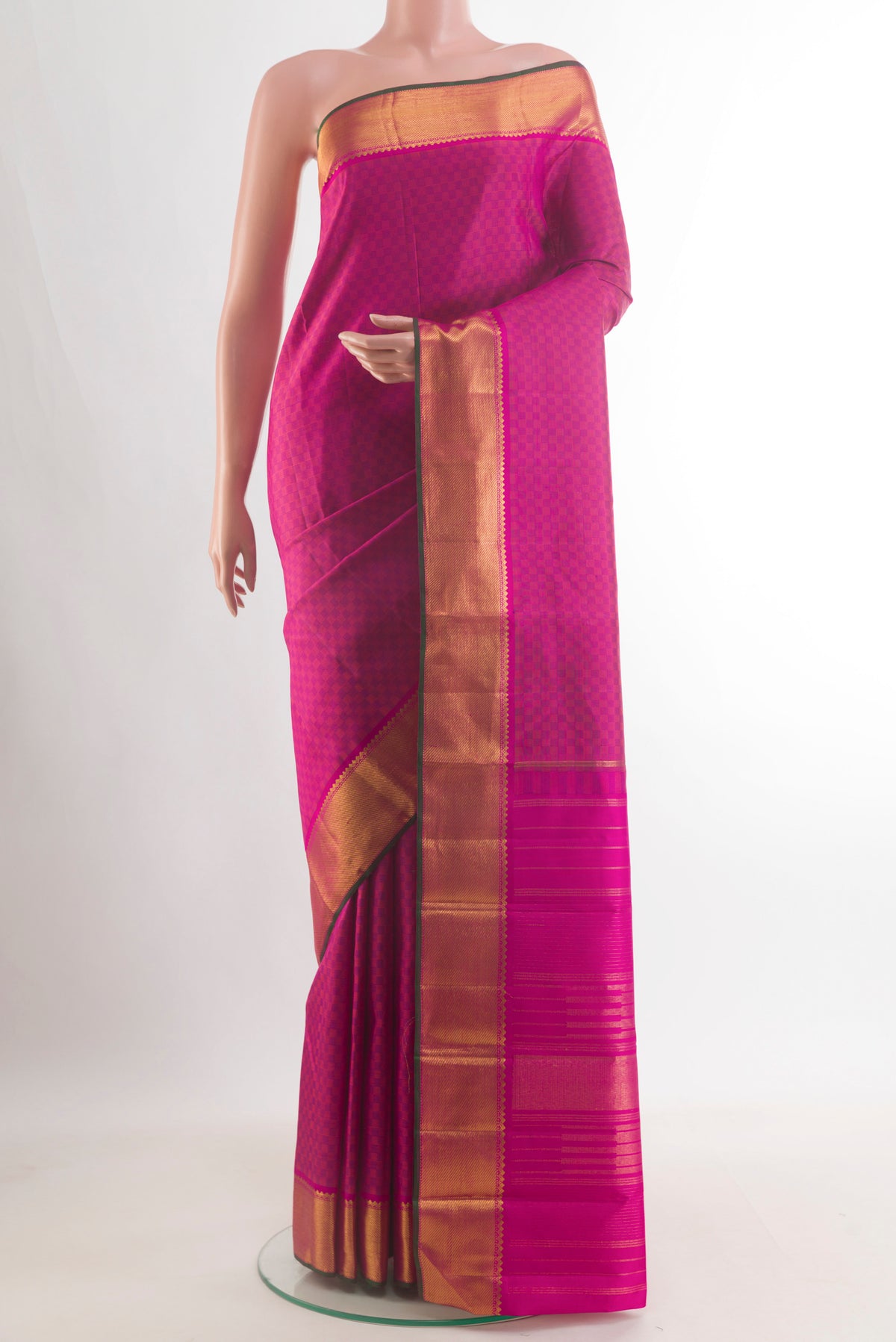 Pure Silk Pink Kanchipuram Saree with Checked design on the body and Zari Border.  displayed on a mannequin