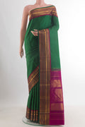 Pure Silk Green Kanchipuram Saree with Jacquard design on the body and Zari Border.  displayed on a mannequin