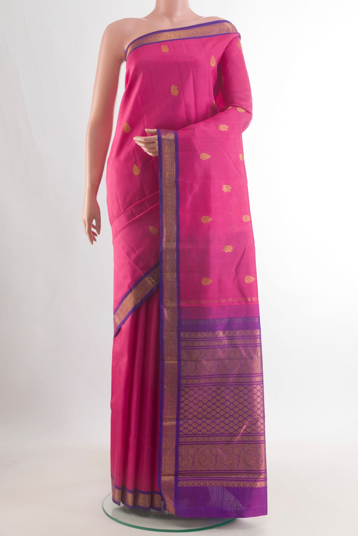 Pure Silk Pink Kanchipuram Saree with Zari Butta on the body and Zari Border.  displayed on a mannequin