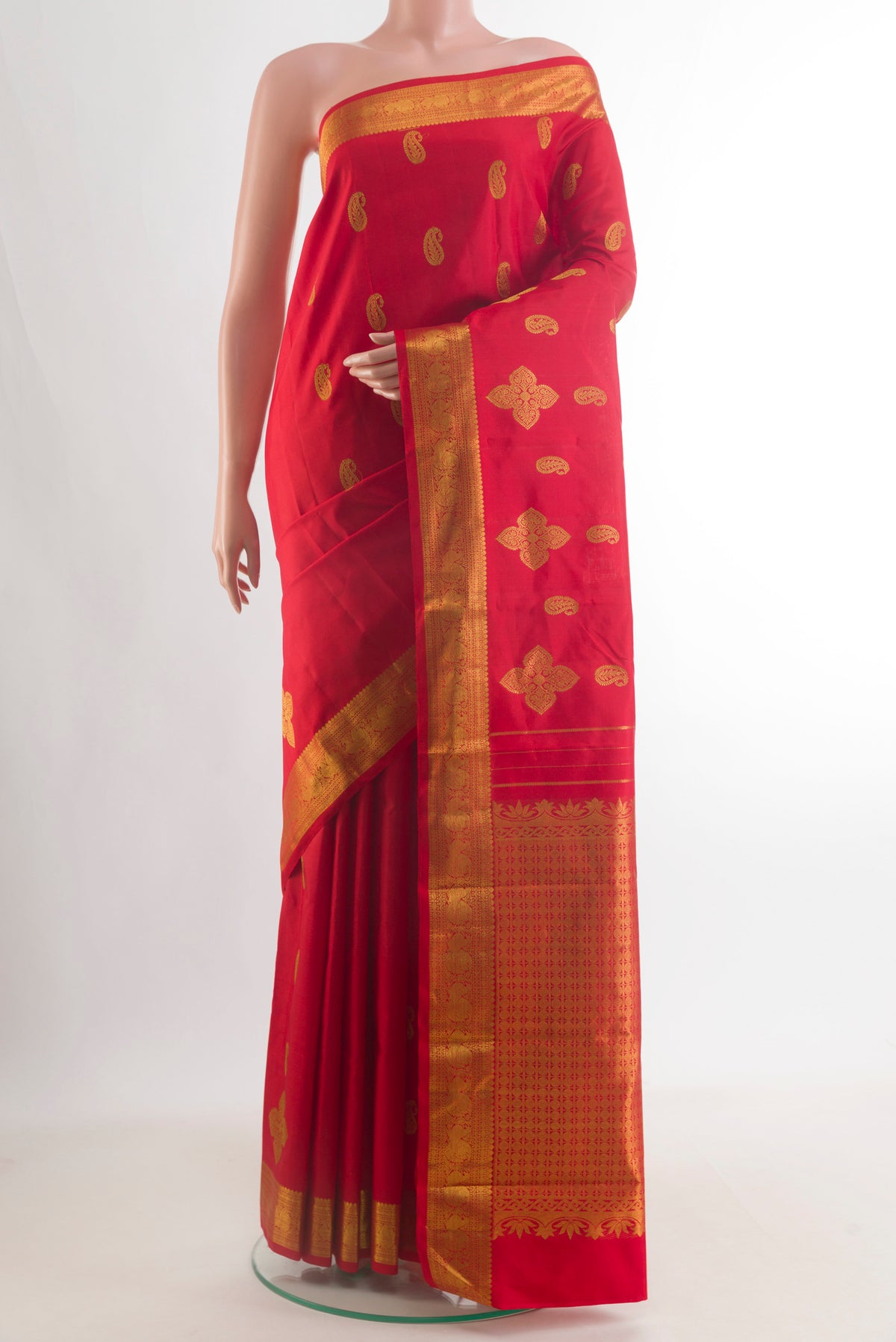 Pure Silk Red Kanjivaram Saree with Zari Butta on the body and Zari Border.  displayed on a mannequin