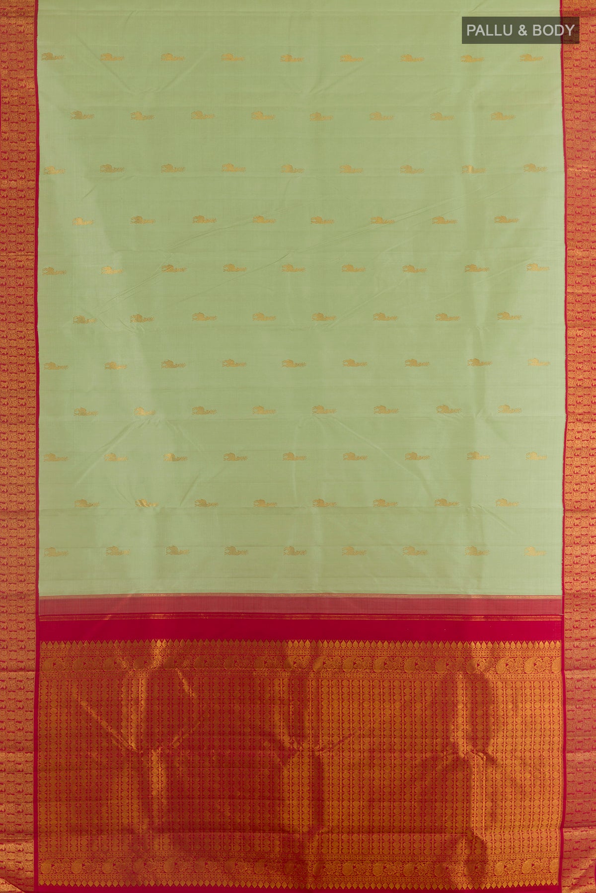 Flat view of Pure Silk Pista Green Kanjivaram Saree with Zari Butta on the body and Zari Border. 