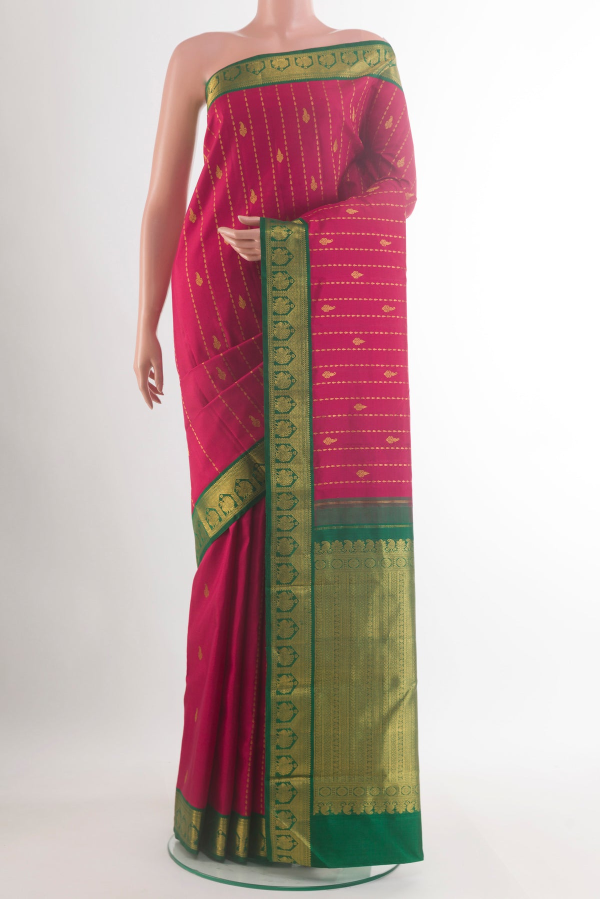 Pure Silk Red Kanjivaram Saree with Zari Butta on the body and Zari Border.  displayed on a mannequin