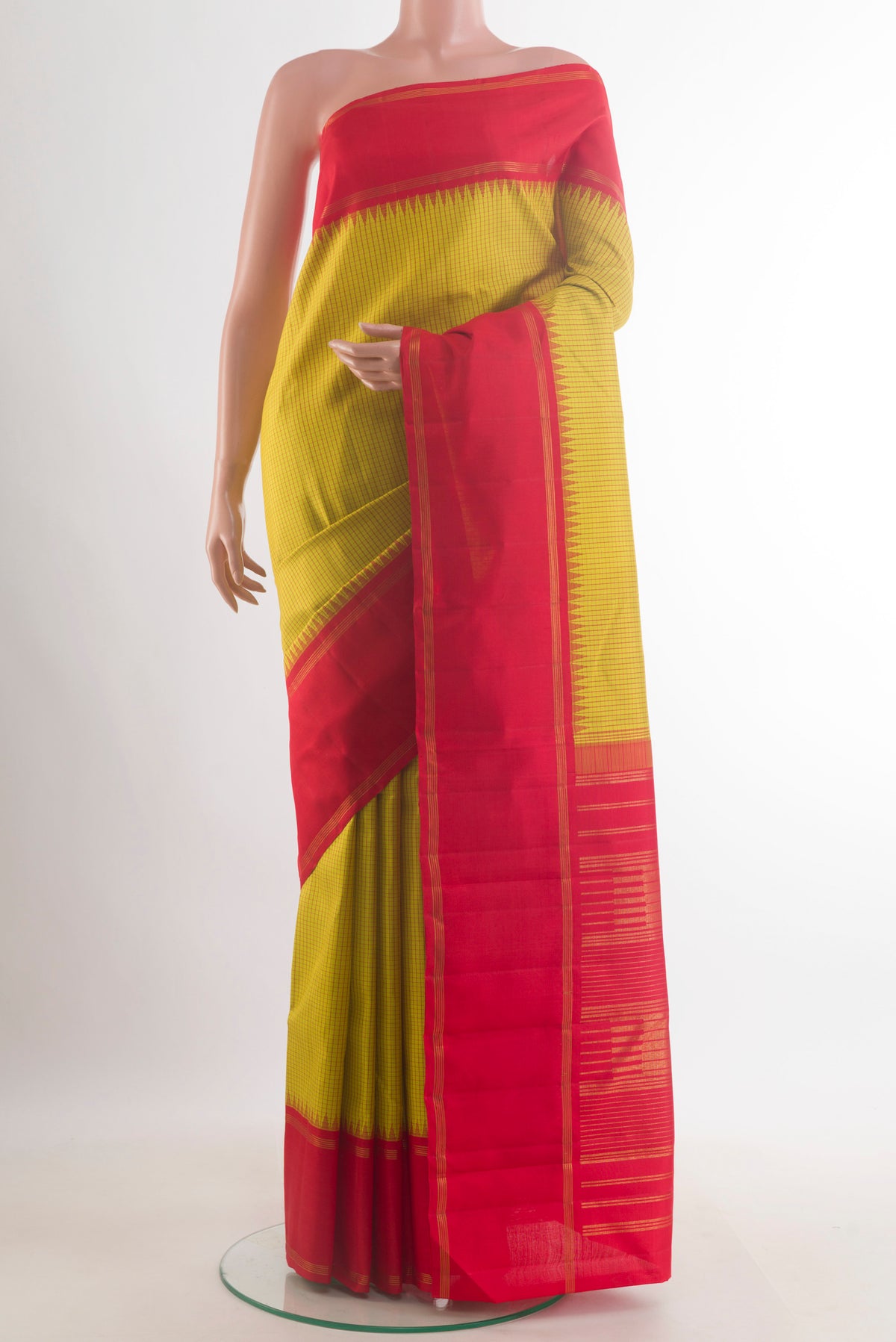 Pure Silk Light Green Kanjivaram Saree with Checked design on the body and Zari Border.  displayed on a mannequin