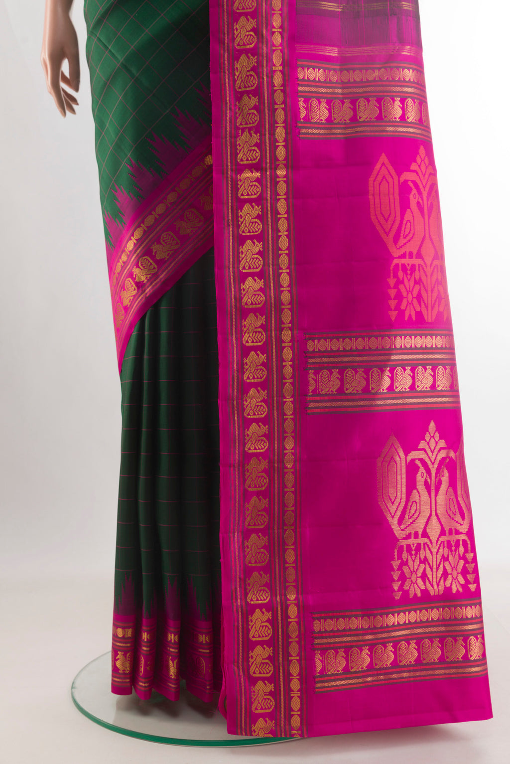 Pleats and pallu of Pure Silk Green Kanjivaram Saree with Checked design on the body and Zari Border. 