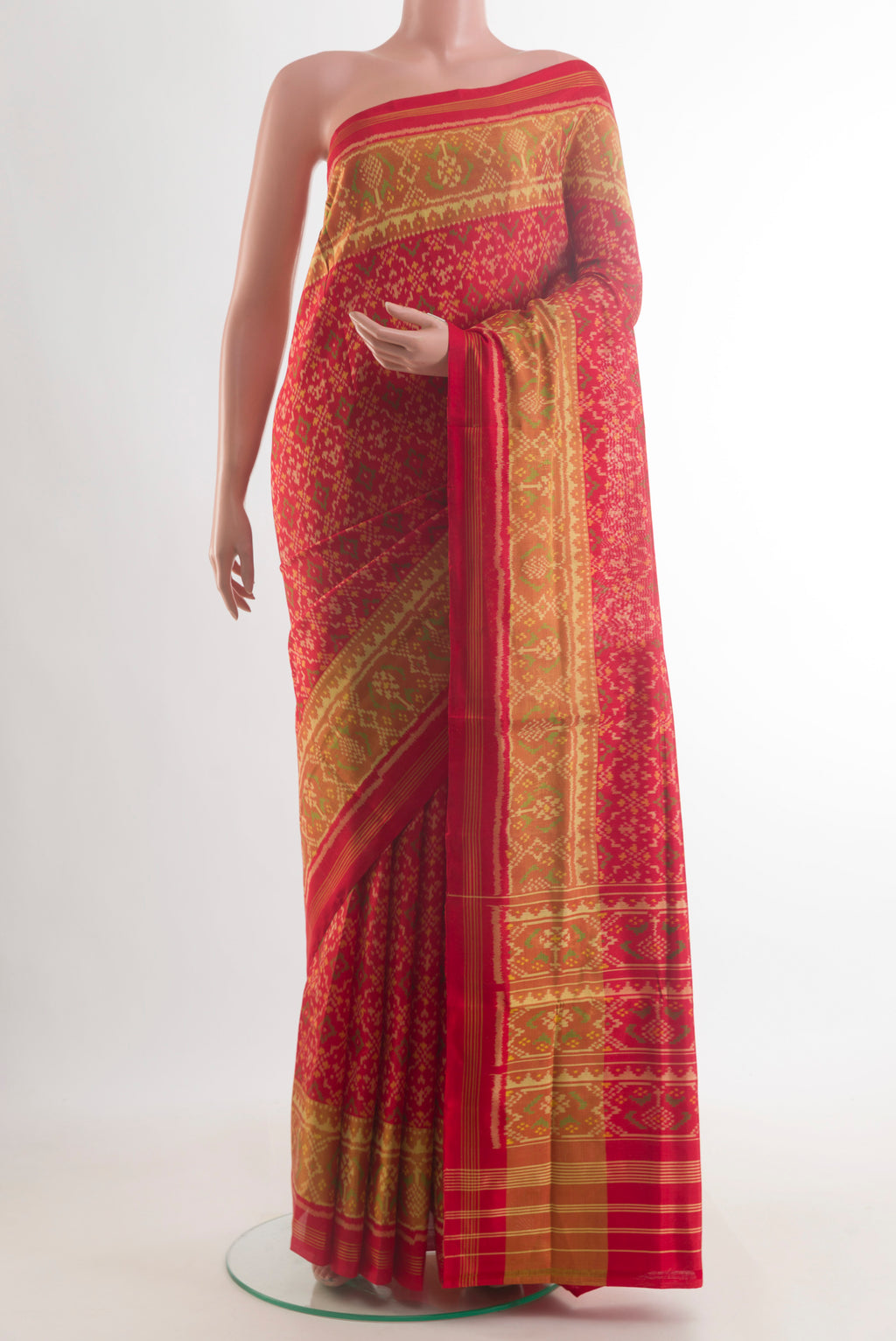 Pure Silk Red Rajkot Patola Saree with Pure Ikat on the body and Ikat Border.  displayed on a mannequin