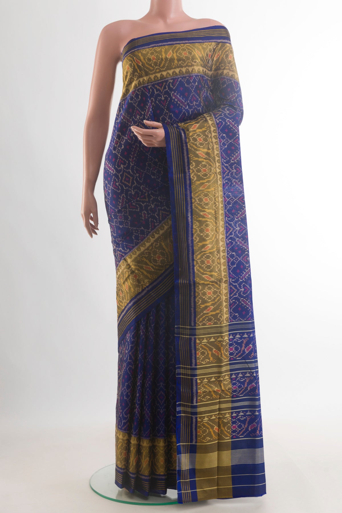 Pure Silk Navy Blue Rajkot Patola Saree with Pure Ikat on the body and Ikat Border.  displayed on a mannequin