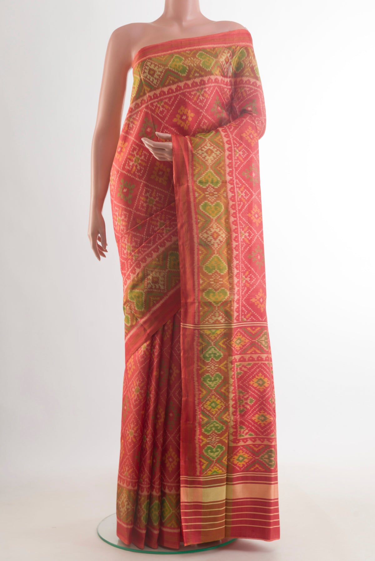 Pure Silk Imperial Red Rajkot Patola Saree with Pure Ikat on the body and Zari Border.  displayed on a mannequin