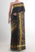 Pure Silk Black Rajkot Patola Saree with Pure Ikat on the body and Ikat Border.  displayed on a mannequin