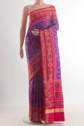 Pure Silk Purple Rajkot Patola Saree with Pure Ikat on the body and Ikat Border.  displayed on a mannequin