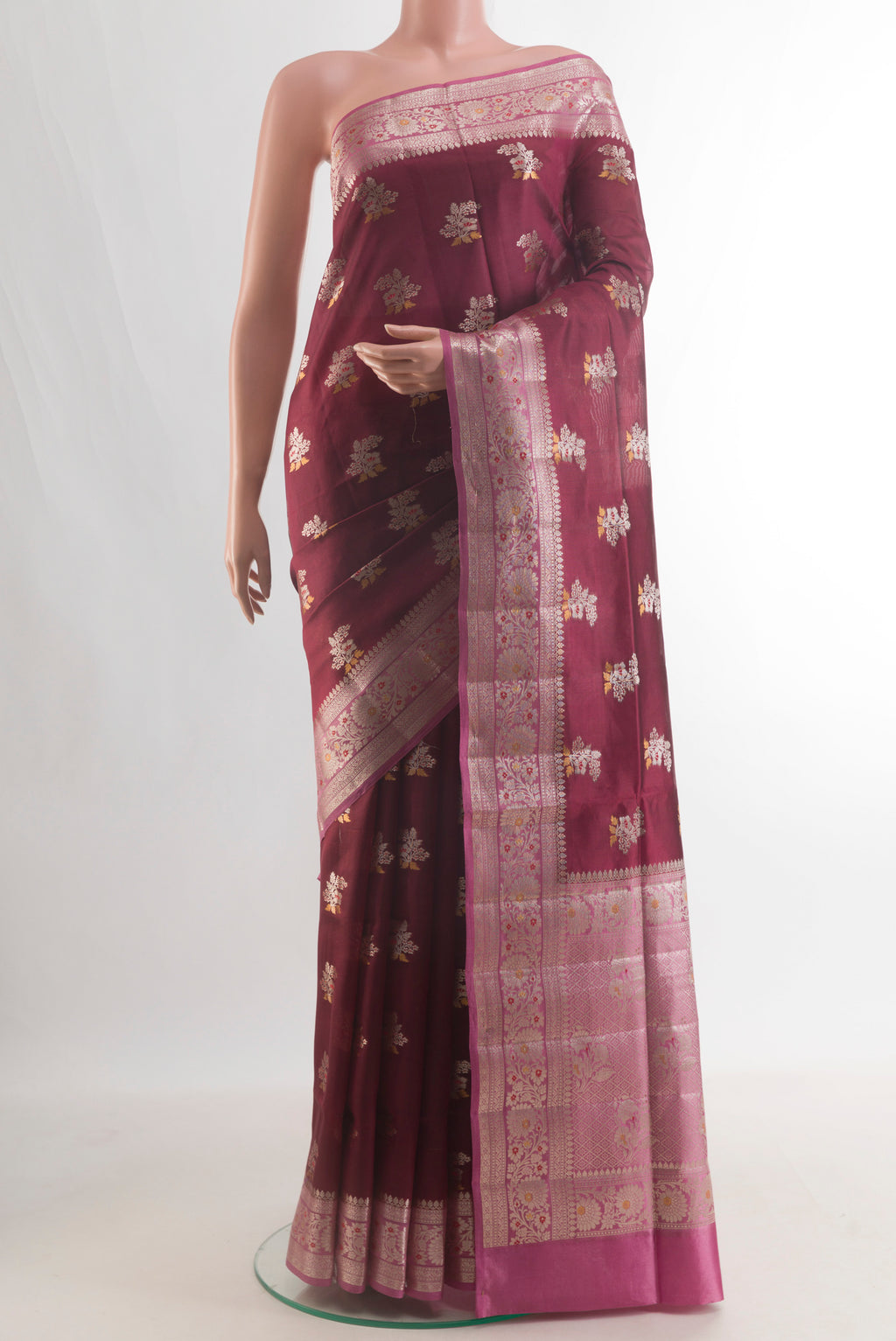 Pure Silk Brown Banarasi Raw Saree with Zari Butta on the body and Zari Border.  displayed on a mannequin