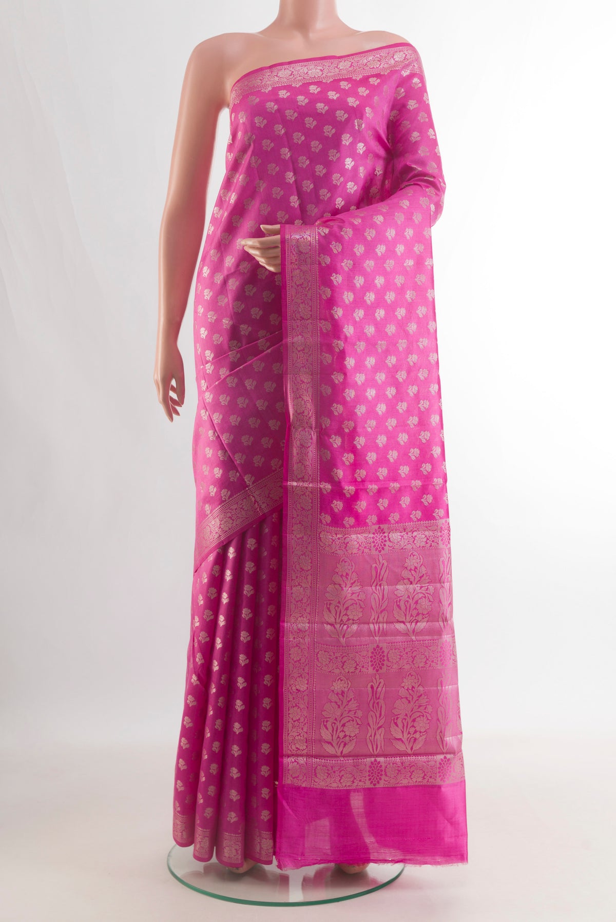 Pure Silk Pink Banarasi Raw Saree with Zari Butta on the body and Zari Border.  displayed on a mannequin