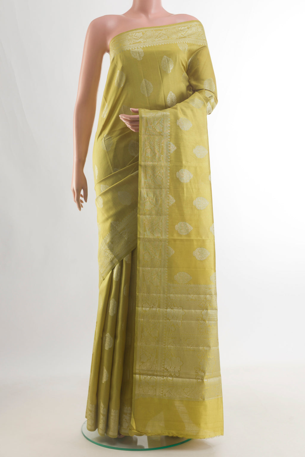 Pure Silk Lemon Yellow Banarasi Raw Saree with Zari Butta on the body and Zari Border.  displayed on a mannequin