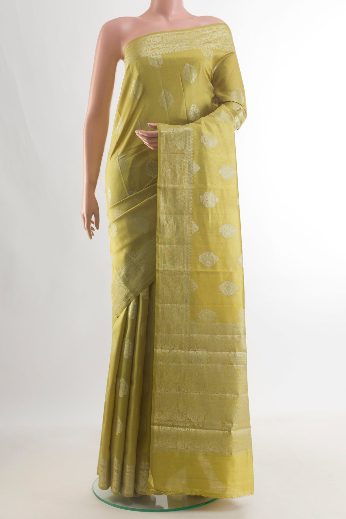 Pure Silk Lemon Yellow Banarasi Raw Saree with Zari Butta on the body and Zari Border.  displayed on a mannequin