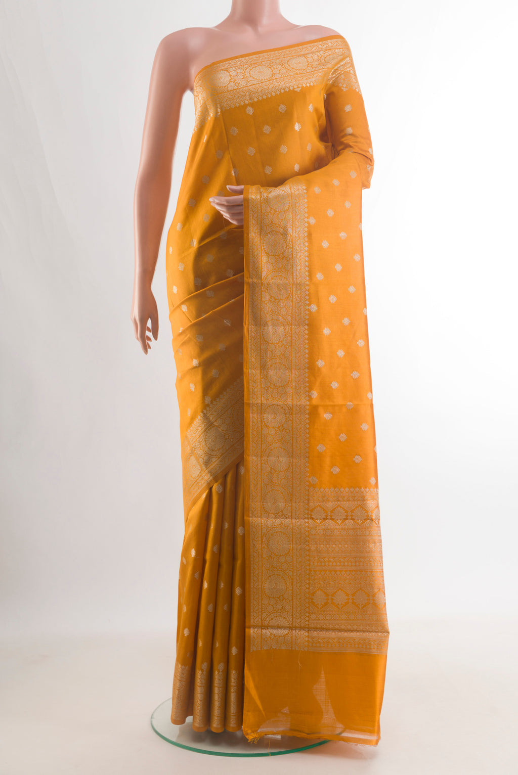 Pure Silk Yellow Banarasi Raw Saree with Zari Butta on the body and Zari Border.  displayed on a mannequin