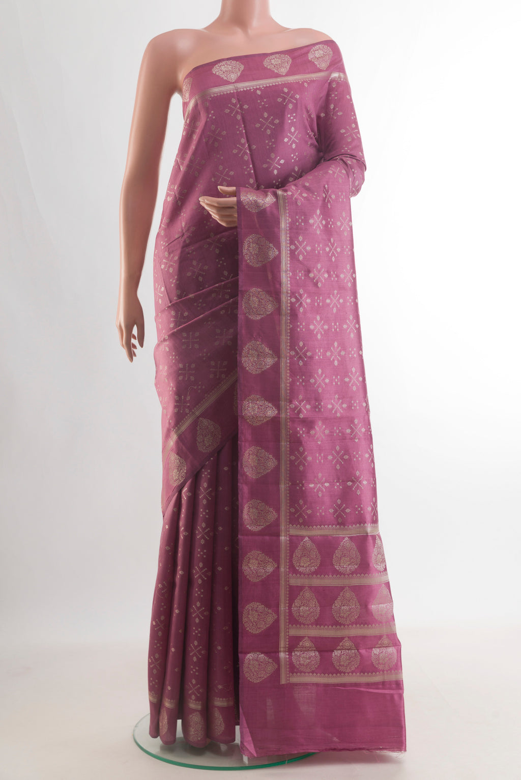 Pure Silk Mauve Banarasi Raw Saree with Zari Butta on the body and Zari Border.  displayed on a mannequin