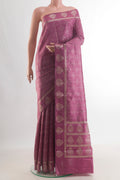 Pure Silk Mauve Banarasi Raw Saree with Zari Butta on the body and Zari Border.  displayed on a mannequin