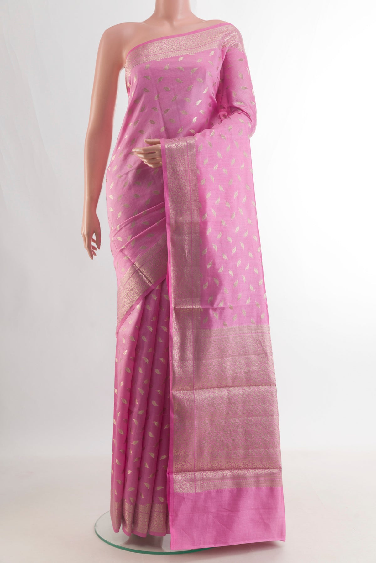 Pure Silk Pink Banarasi Raw Saree with Zari Butta on the body and Zari Border.  displayed on a mannequin