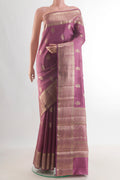 Pure Silk Mauve Banarasi Raw Saree with Zari Butta on the body and Zari Border.  displayed on a mannequin