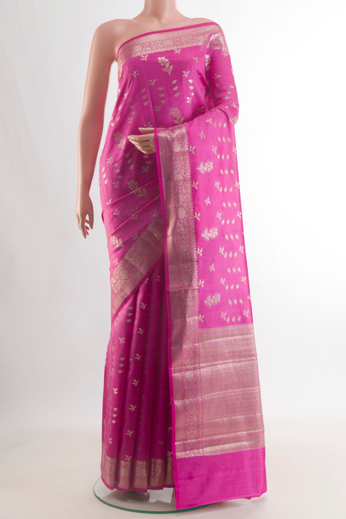Pure Silk Pink Banarasi Raw Saree with Zari Butta on the body and Zari Border.  displayed on a mannequin