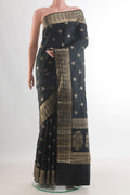 Pure Silk Black Banarasi Raw Saree with Zari Butta on the body and Zari Border.  displayed on a mannequin