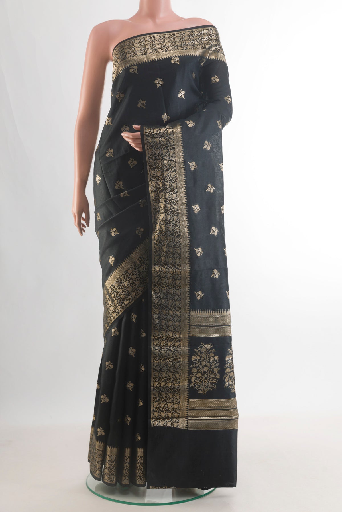 Pure Silk Black Banarasi Raw Saree with Zari Butta on the body and Zari Border.  displayed on a mannequin